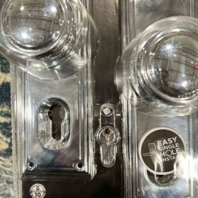 Packaged Gainsborough Trilock entrance set with clear door knobs and installation instructions.